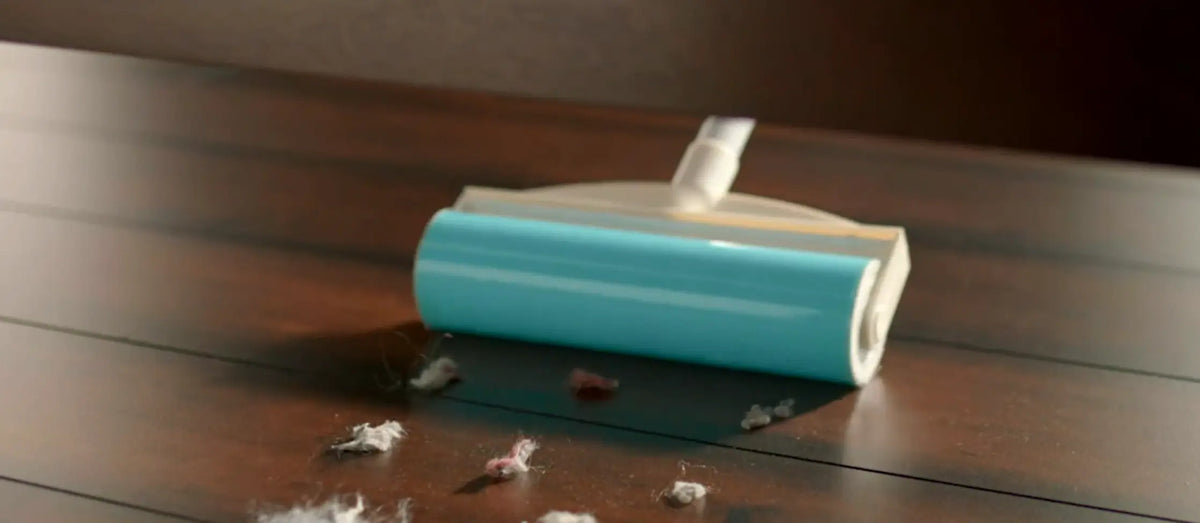 Lint Roller cleaning fluff under a bed